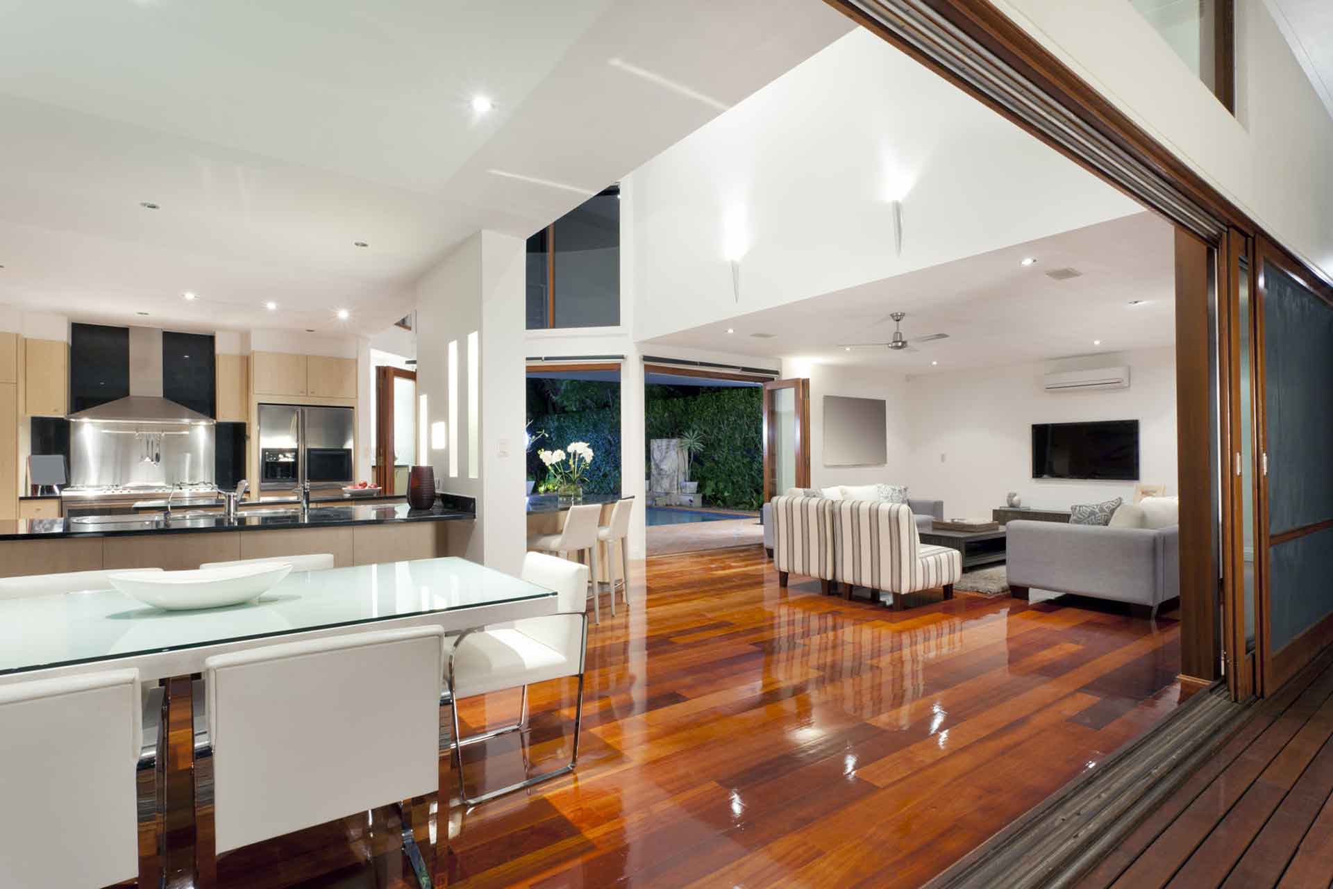 a couple of people standing in front of a forest of lights